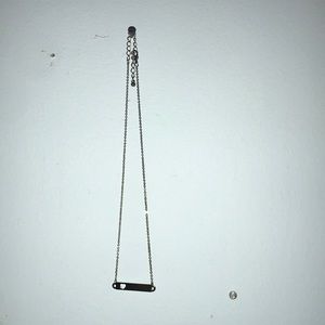 gold bar necklace with heart cutout